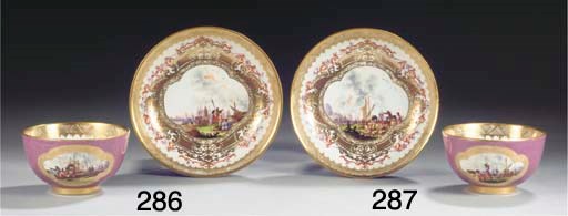 (2)  A Meissen porcelain gilt purple-ground 'Kauffahrteiszenen' teabowl and saucer