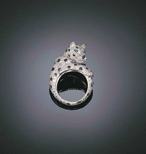 A DIAMOND AND ONYX "PANTHER" RING, BY CARTIER