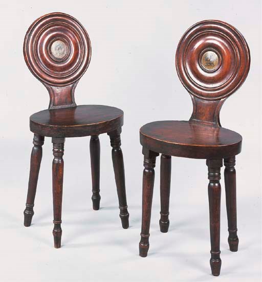 A NEAR PAIR OF GEORGE IV ELM HALL CHAIRS
