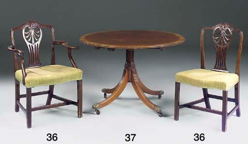 A MAHOGANY CIRCULAR DINING TABLE