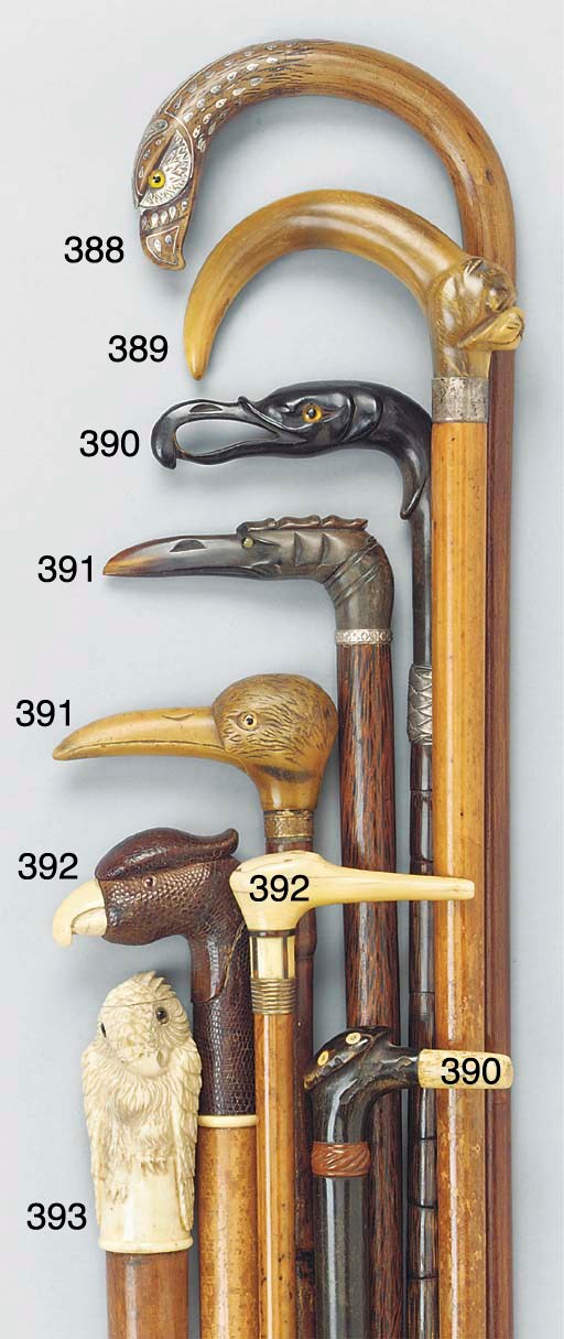 A Continental carved horn mounted coconut wood walking stick