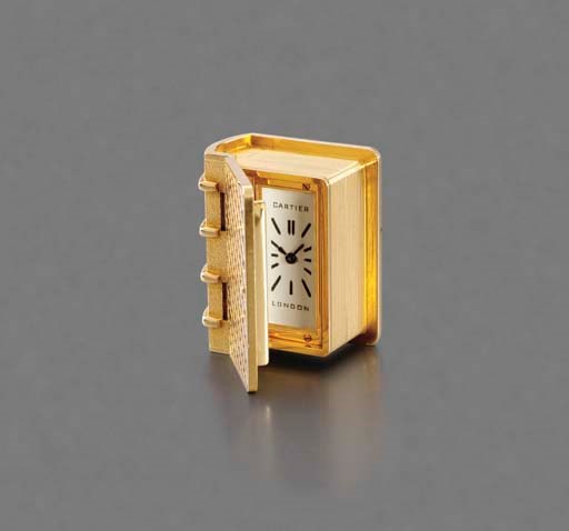 Cartier. An unusual 18K gold book-form watch