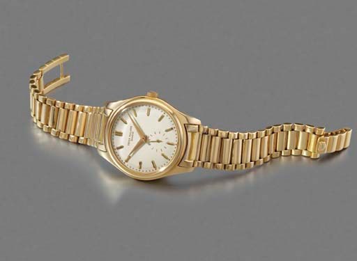 Patek Philippe. A fine and rare 18K gold self-winding waterproof wristwatch with bracelet and enamel dial