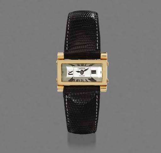Cartier. A fine and rare 18K gold rectangular backwound Driver's wristwatch