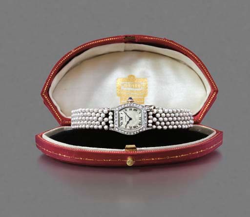Cartier. A fine and rare lady's Art Deco platinum, diamond and pearl-set Tortue wristwatch with bracelet
