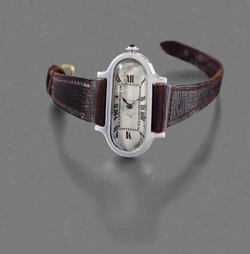 Cartier. A fine and unusual platinum oval Driver's wristwatch