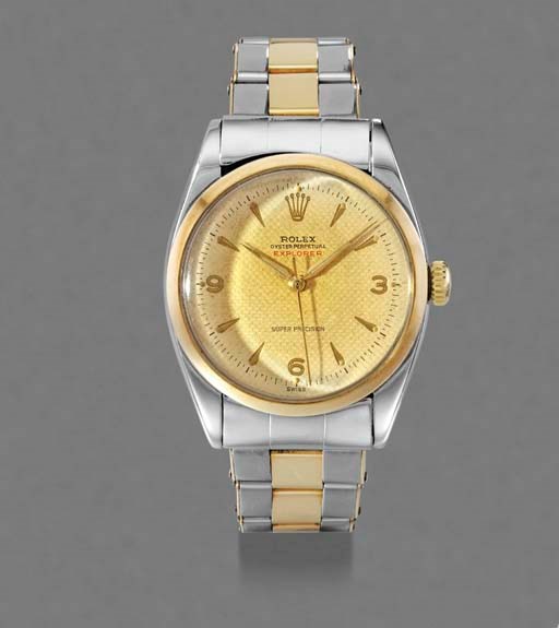 Rolex. A stainless steel and gold self-winding waterproof wristwatch with sweep centre seconds, bracelet and honeycomb dial