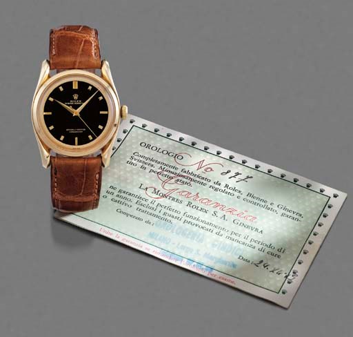 Rolex. A fine and rare 18K gold self-winding waterproof wristwatch with sweep centre seconds, black lacquered dial and fancy lugs