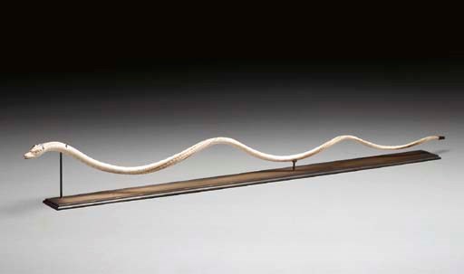 AN IVORY SNAKE-FORM CARVING