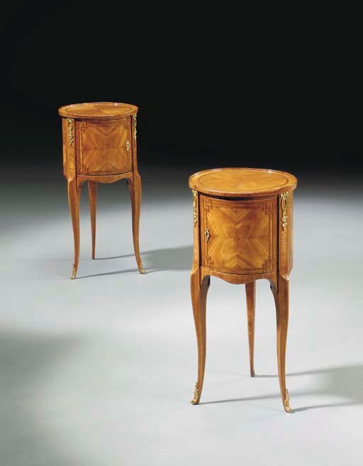 A PAIR OF FRENCH ORMOLU-MOUNTED TULIPWOOD AND PARQUETRY TABLES EN CHIFFONIERE