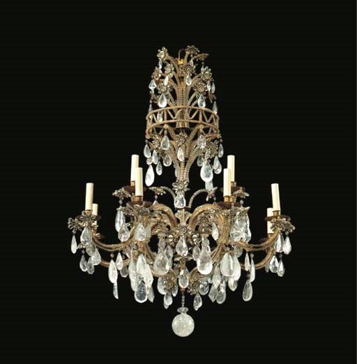 A FRENCH GILT-METAL, ROCK CRYSTAL AND CUT-GLASS TWELVE-LIGHT CHANDELIER