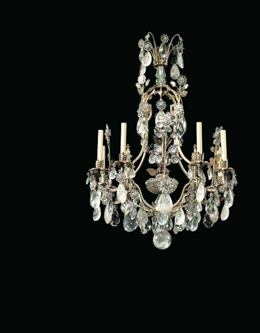 A FRENCH CUT-AND-MOLDED COLORLESS-GLASS, ROCK CRYSTAL AND SILVERED METAL EIGHT-LIGHT CHANDELIER
