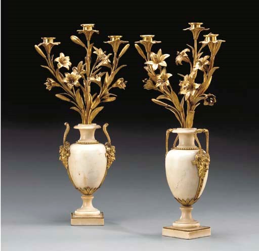A PAIR OF LOUIS XVI STYLE ORMOLU AND WHITE MARBLE THREE-LIGHT CANDELABRA