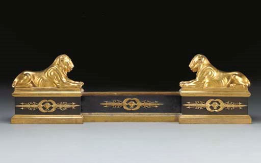 AN EMPIRE ORMOLU AND PATINATED-BRONZE EXTENDING FIRE FENDER