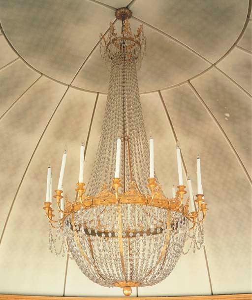 A NORTH EUROPEAN ORMOLU, GILT-METAL AND CUT-GLASS SIXTEEN-LIGHT CHANDELIER