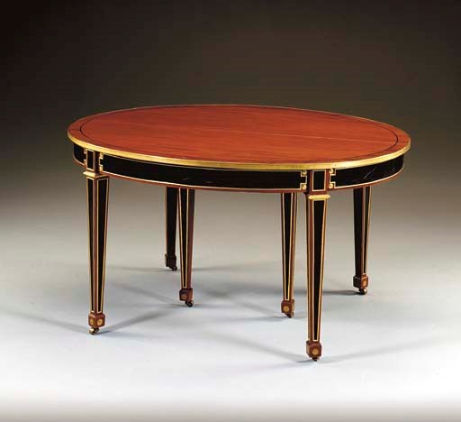 A NORTH EUROPEAN ORMOLU-MOUNTED AND BRASS-INLAID MAHOGANY AND EBONY EXTENDING DINING-TABLE
