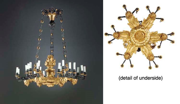 A GILT AND PATINATED METAL TWENTY-FOUR LIGHT CHANDELIER