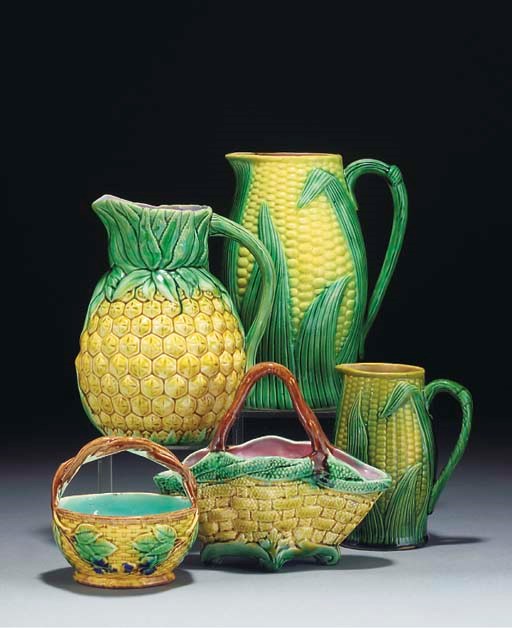 Five majolica jugs, two baskets and a porcelain jug