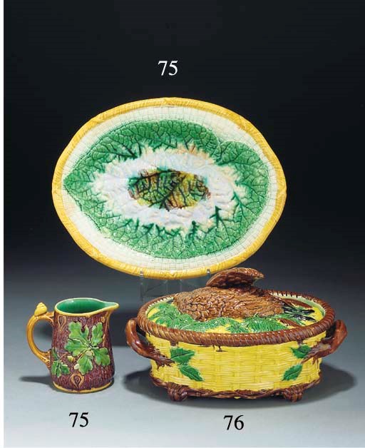 A Minton majolica jug, another similar and a majolica dish