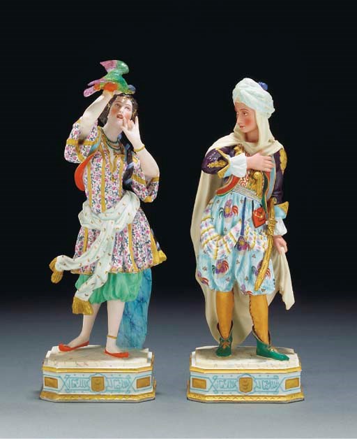 A pair of French biscuit Turkish figures of a gentleman and companion
