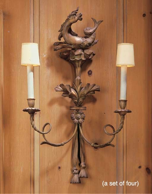 A SET OF FOUR LIMEWOOD AND COMPOSITION TWIN-BRANCH WALL-LIGHTS