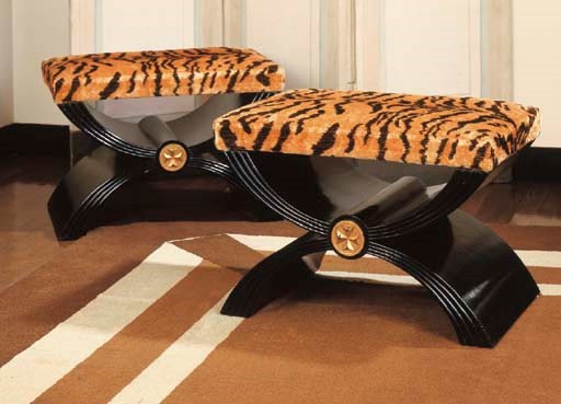 A PAIR OF EBONIZED X-FORM STOOLS