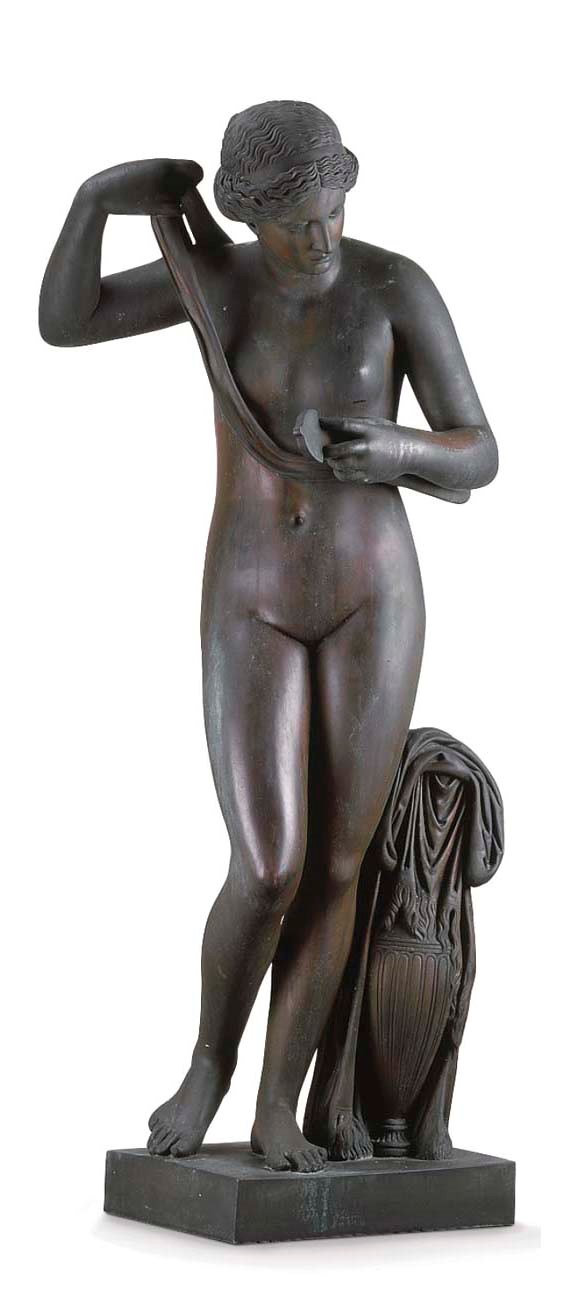 A BRONZE FEMALE MOURNING FIGURE