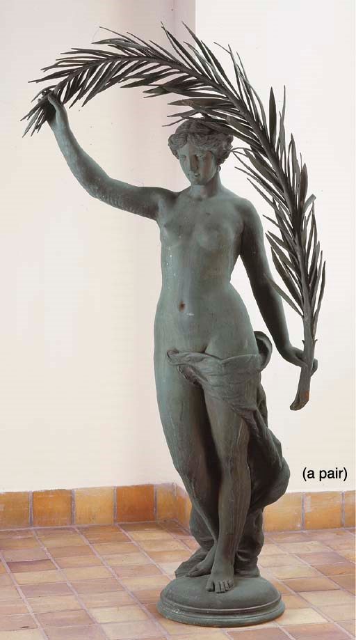 A PAIR OF WHITE METAL FEMALE FIGURES