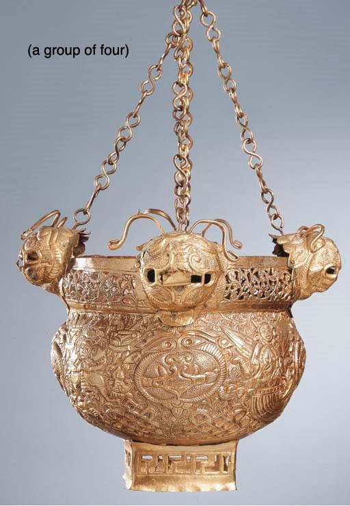 FOUR SOUTHEAST ASIAN GOLD PLATED HANGING LANTERNS