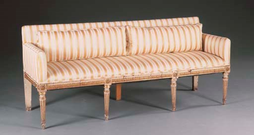 AN ITALIAN WHITE-PAINTED AND PARCEL-GILT SETTEE