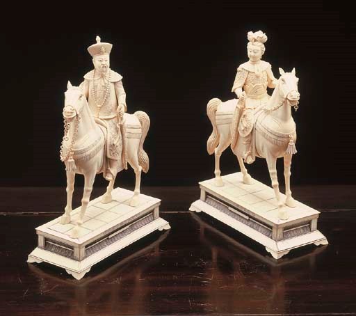 A PAIR OF CHINESE CARVED IVORY EQUESTRIAN FIGURES**