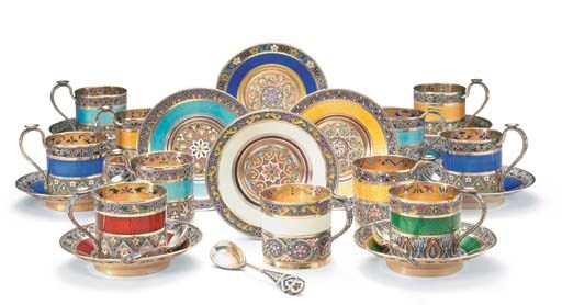 TWELVE RUSSIAN SILVER-GILT CLOISONNÉ, GUILLOCHÉ AND PLIQUE-Á-JOUR ENAMEL TEACUPS, SAUCERS AND TEN SPOONS