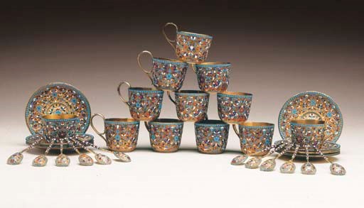 TWELVE RUSSIAN SILVER-GILT CLOISONNÉ ENAMEL TEACUPS, ELEVEN SAUCERS, AND TWELVE TEASPOONS