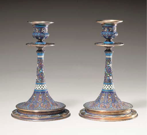 A PAIR OF RUSSIAN SILVER-GILT CLOISONNÉ ENAMEL CANDLESTICKS
