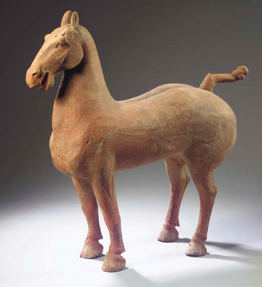 A red pottery model of a horse