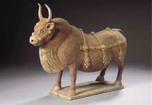 A painted grey pottery model of an ox