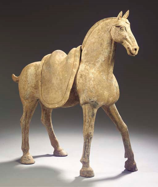 A painted grey pottery model of a horse