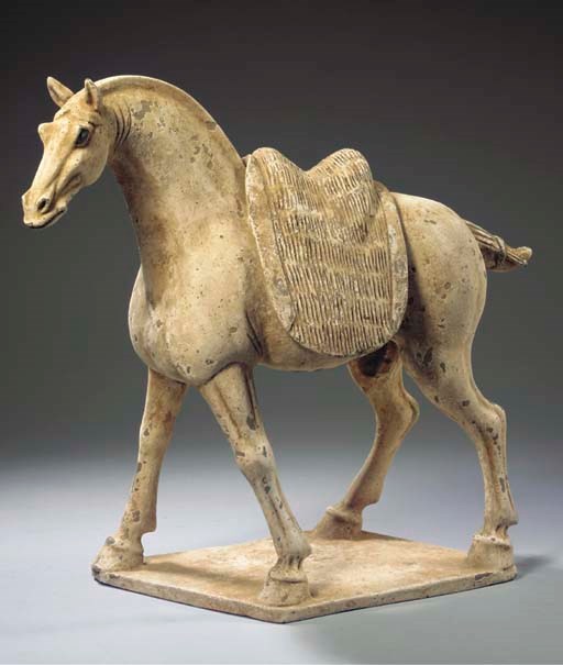 A painted grey pottery model of a horse
