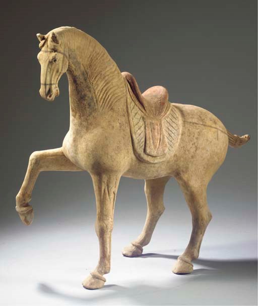 A painted pottery figure of a horse