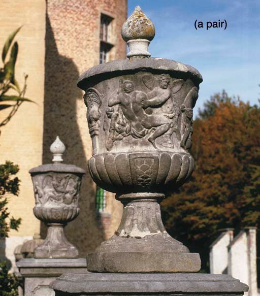 A PAIR OF STONE URNS WITH MYTHOLOGICAL SCENES