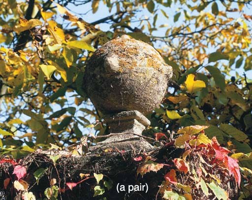 A PAIR OF SCULPTED STONE PIER FINIALS