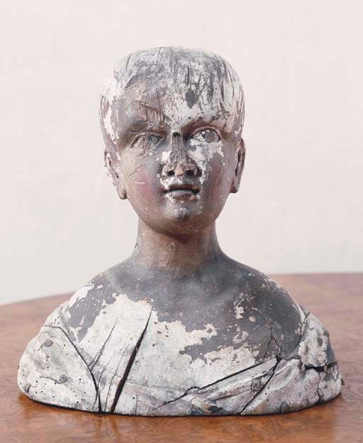 A GERMAN POLYCHROME CARVED WOOD BUST OF A YOUTH