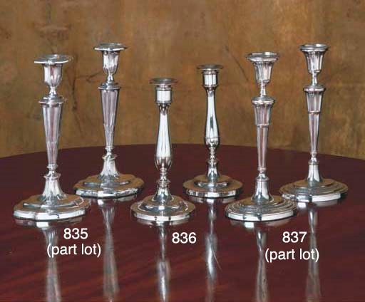 A PAIR OF ENGLISH SILVER-PLATED CANDLESTICKS AND A SILVER-PLATED MUFFIN-DISH
