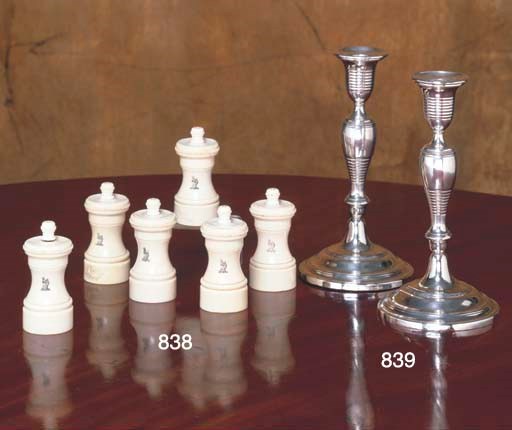 A PAIR OF ENGLISH SILVER-PLATED CANDLESTICKS