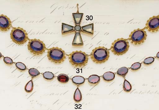 An early 19th century gold and green foiled quartz cross pendant,