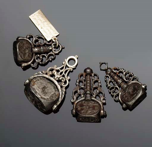 Four early 19th century iron fob seals,