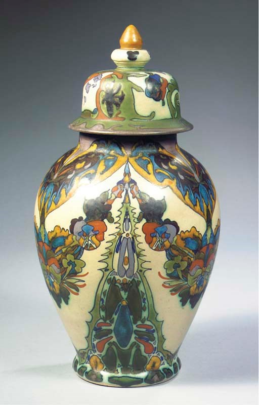 A GLAZED POTTERY VASE AND COVER