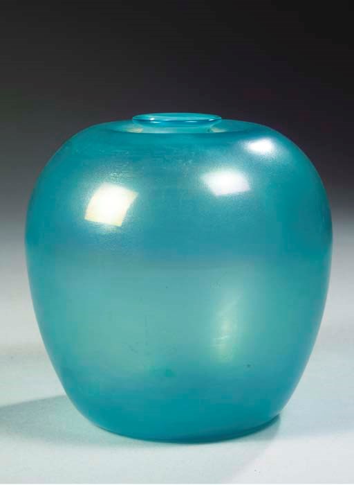 A LIGHT BLUE GLASS VASE