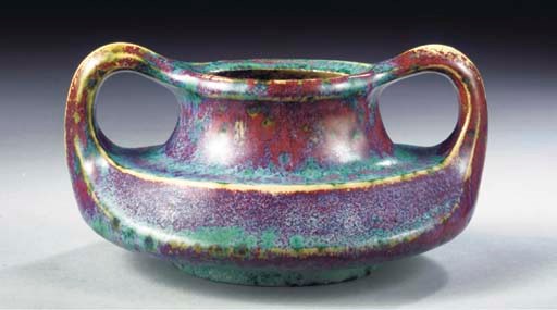 A GLAZED POTTERY TWO-HANDLED VASE