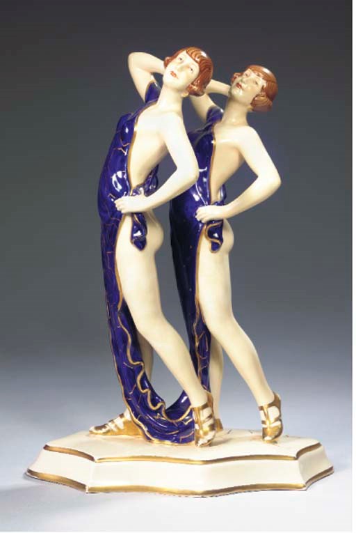 A GILT PORCELAIN FIGURAL GROUP